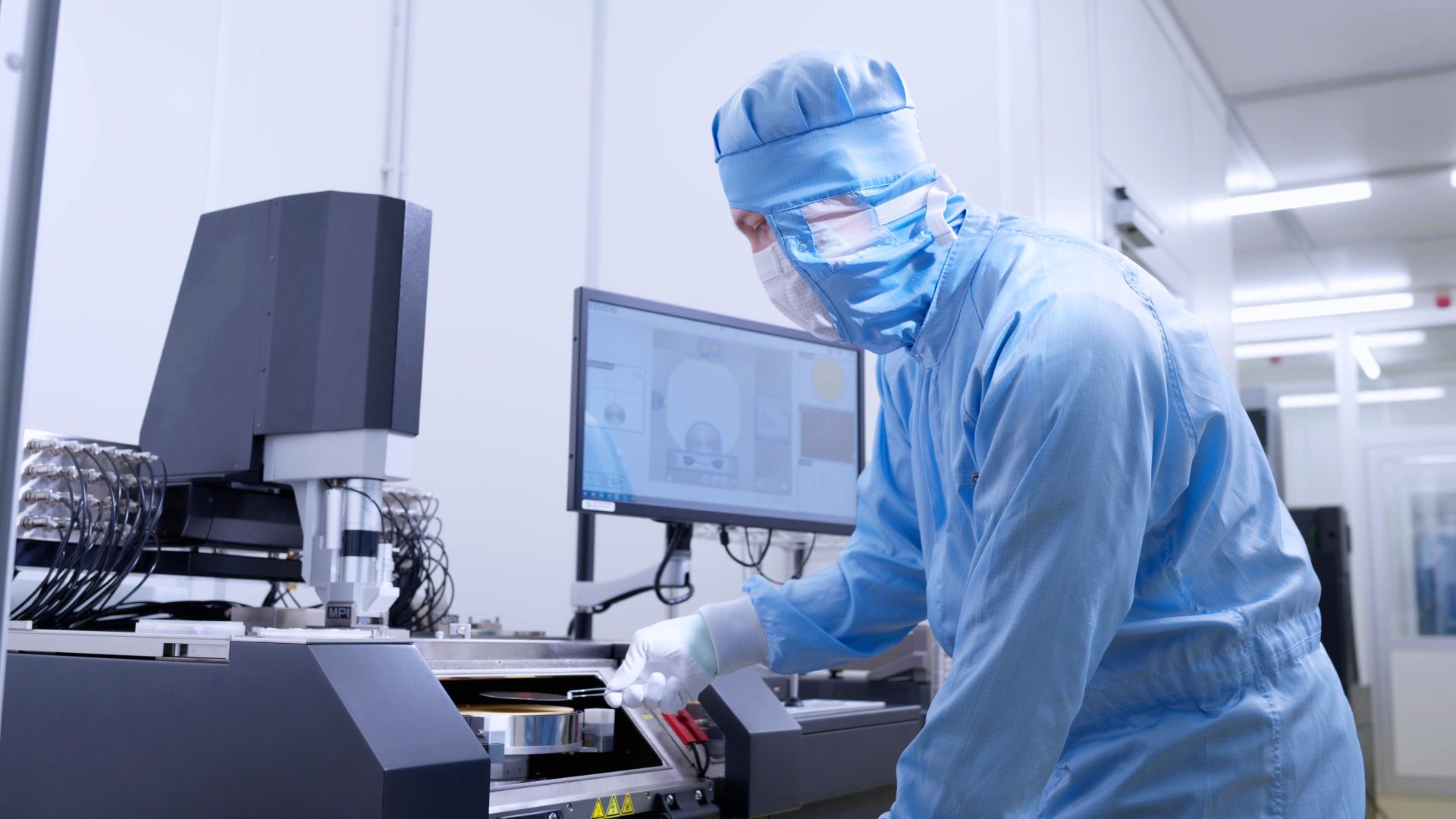 A researcher works in a clean room.